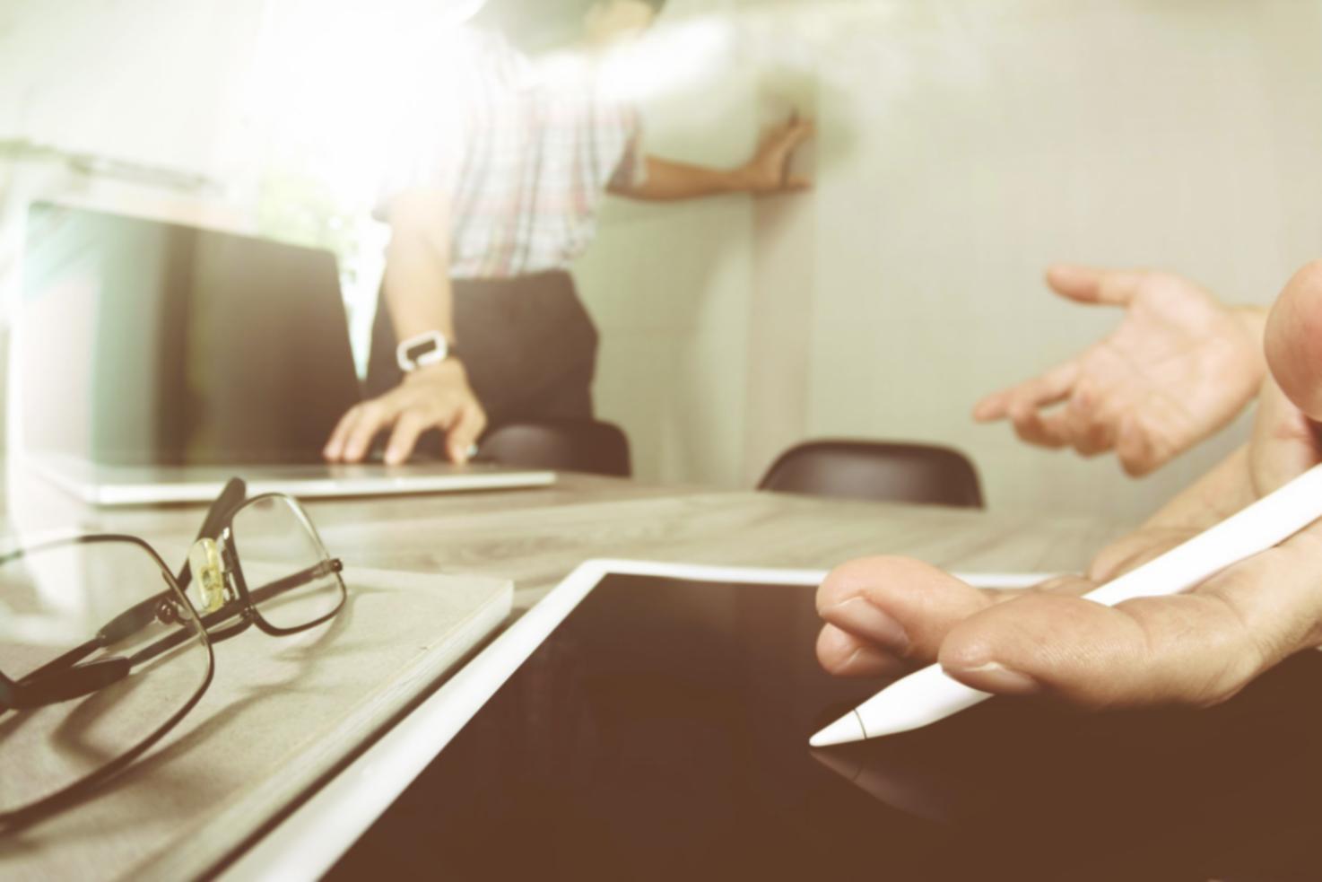 Collaborative workspace showing team working through blockchain implementation challenges